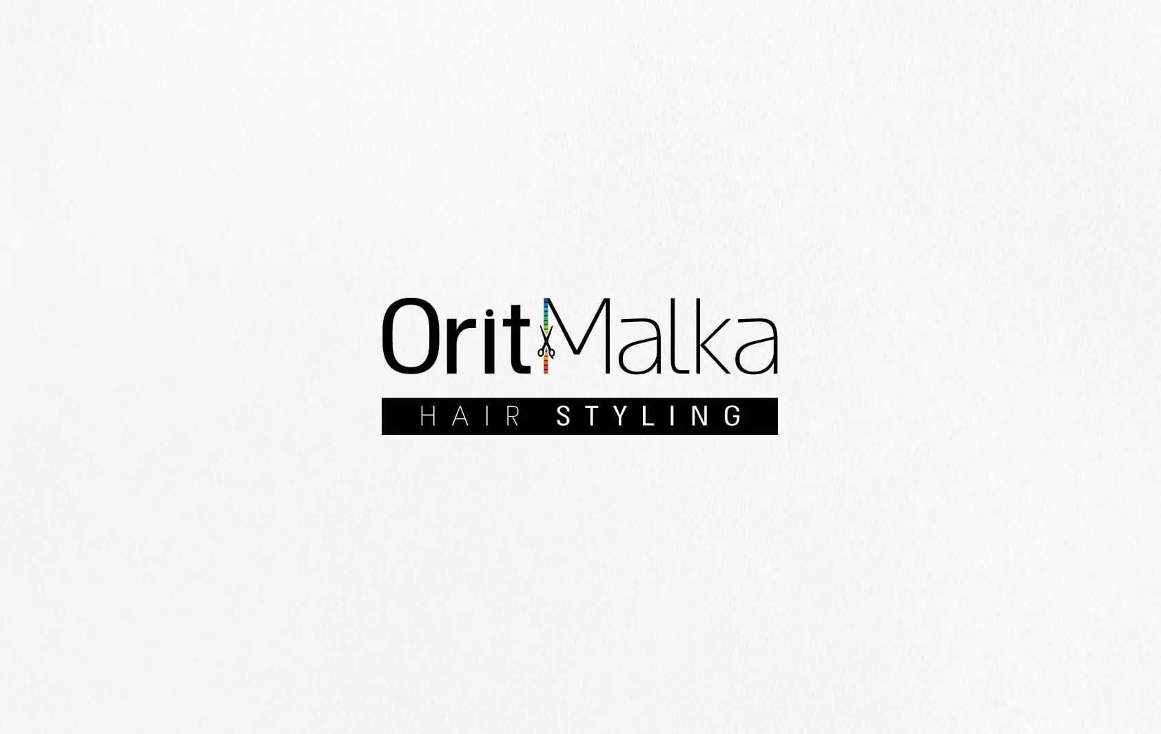 לוגו Orit Malka Hair Styling עם אייקון מספריים צבעוני במקום האות של השם