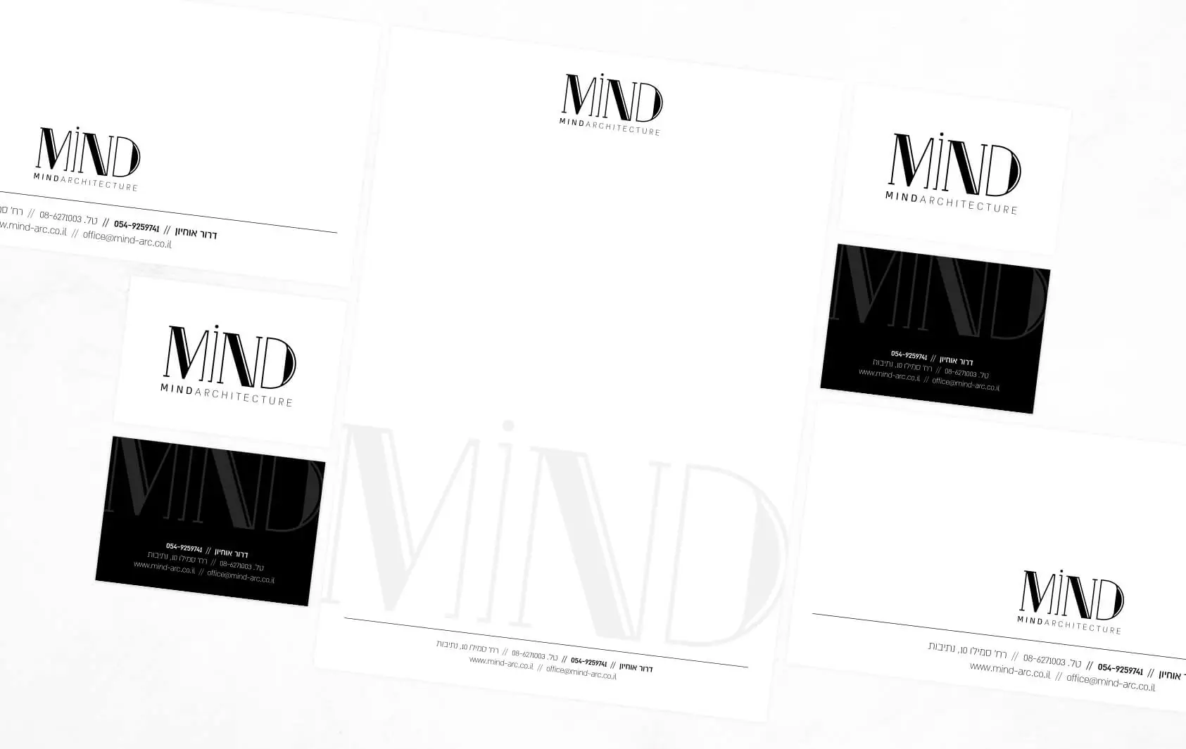 רשת כרטיסי ביקור ונייר מכתבים של MIND Architecture בשחור לבן מונחים באלכסון