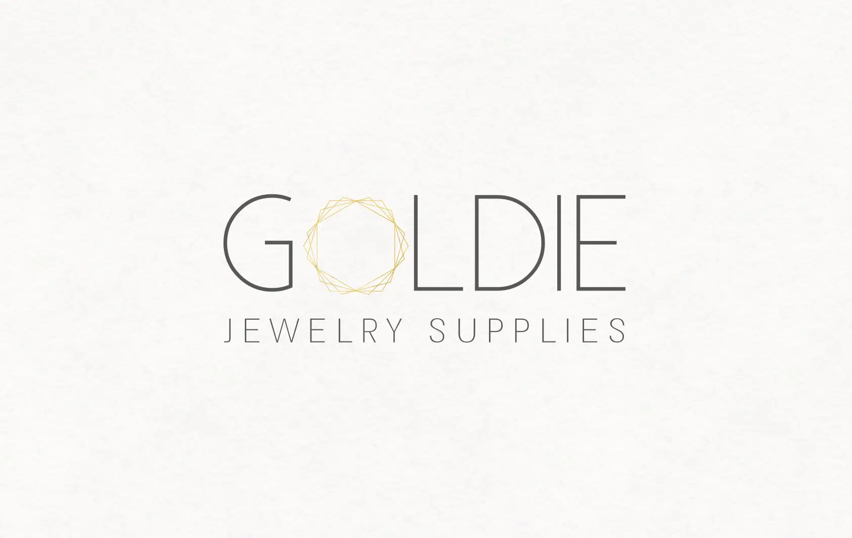 לוגו GOLDIE Jewelry Supplies עם איקון יהלום זהוב בעיצוב טיפוגרפי מינימליסטי